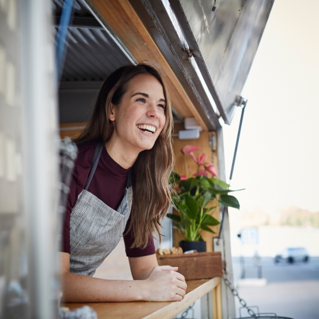 A small business owner working at a food truck
